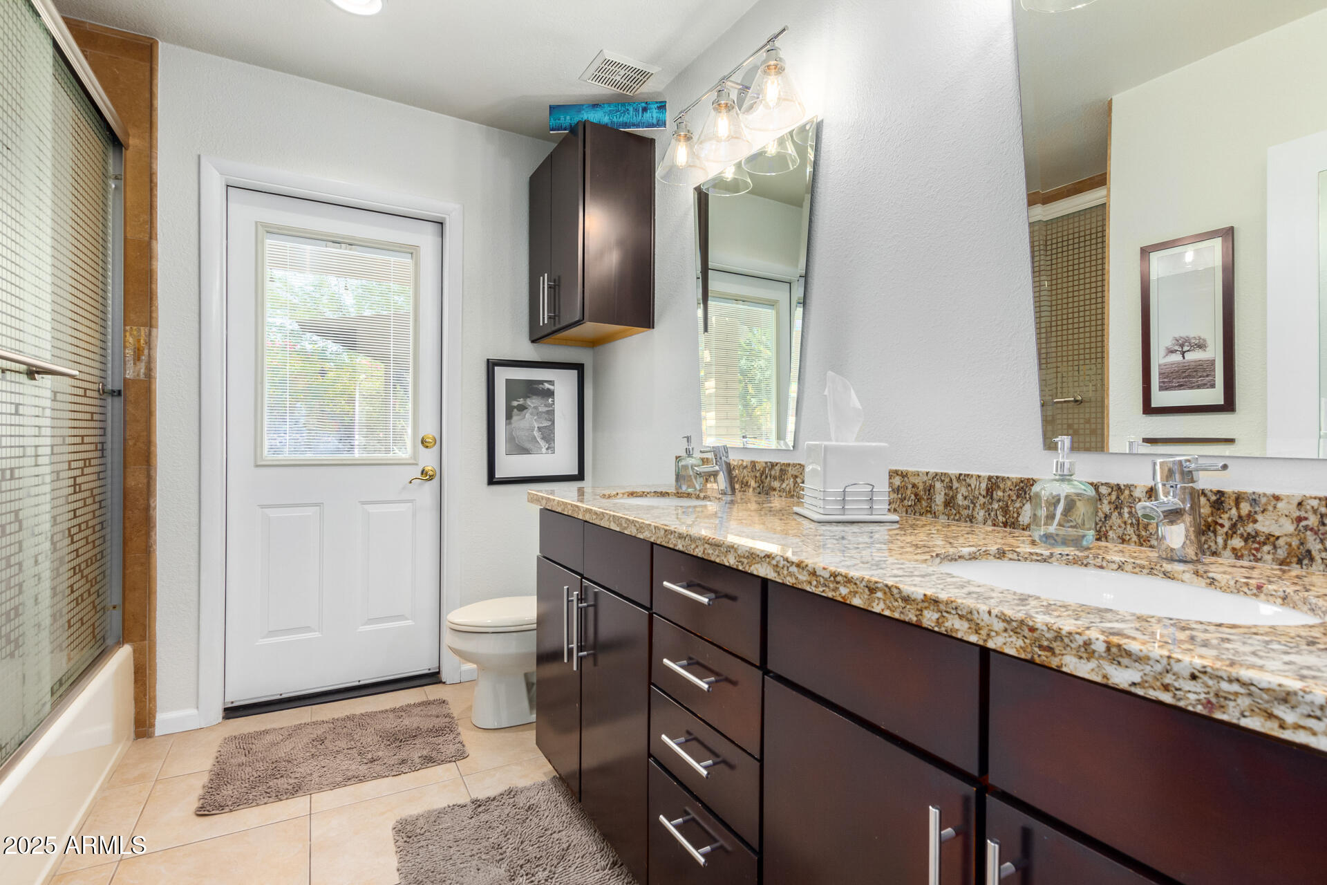2909 East Las Rocas Drive Phoenix, AZ 85028 - Photo 26 of 48 a bathroom with a granite countertop sink toilet and mirror