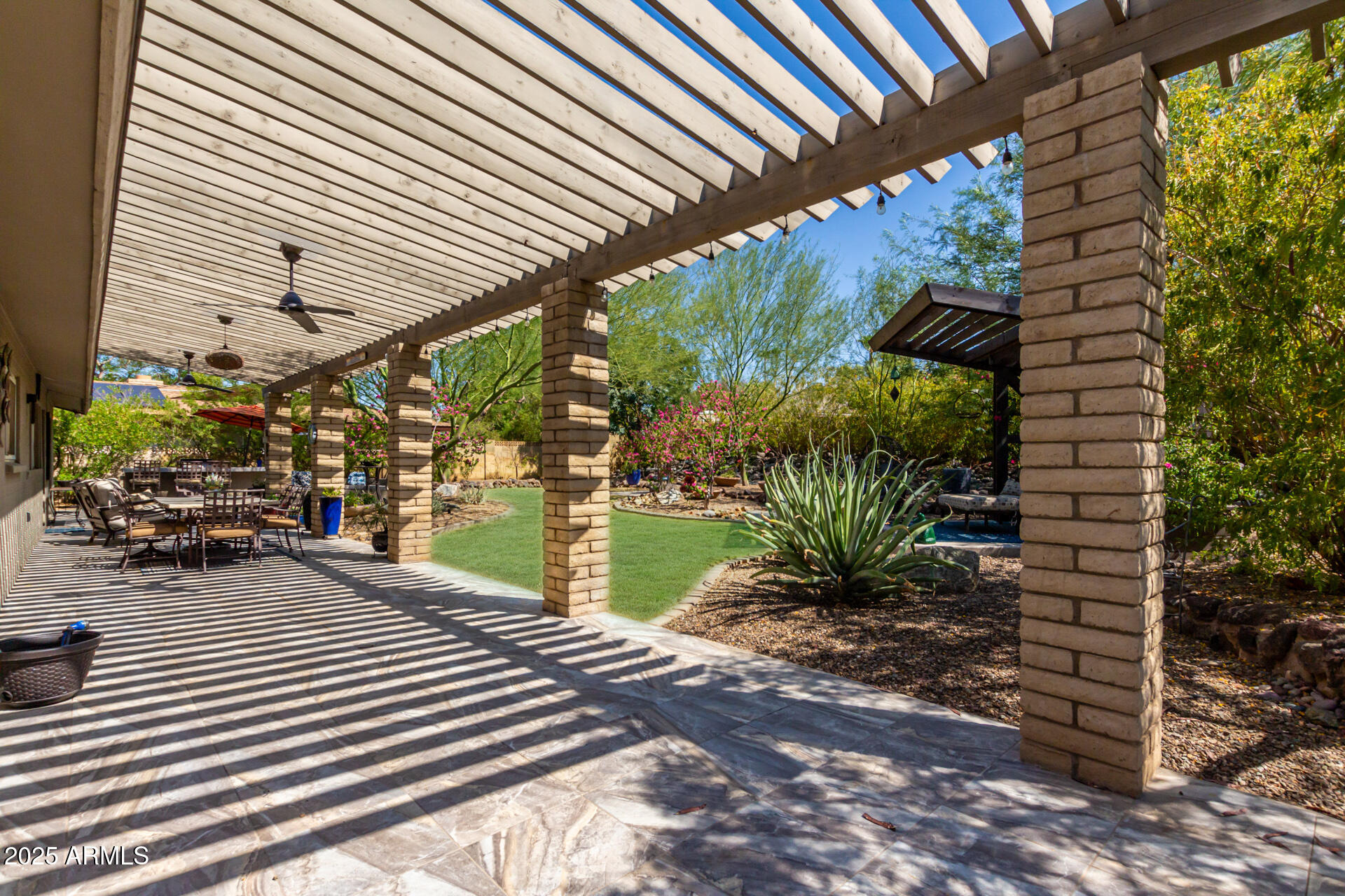 2909 East Las Rocas Drive Phoenix, AZ 85028 - Photo 33 of 48 a view of a chairs and table in patio