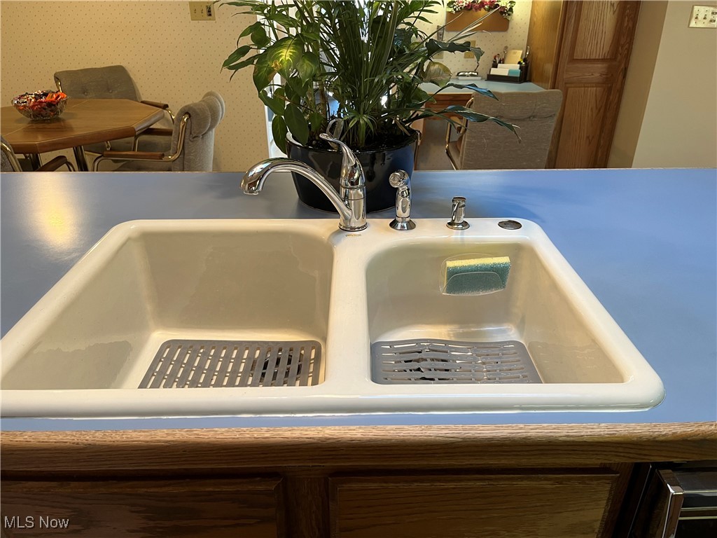 13735 Milo Road Cleveland, OH 44125 - Photo 11 of 49 Kitchen Island has a Double Sink