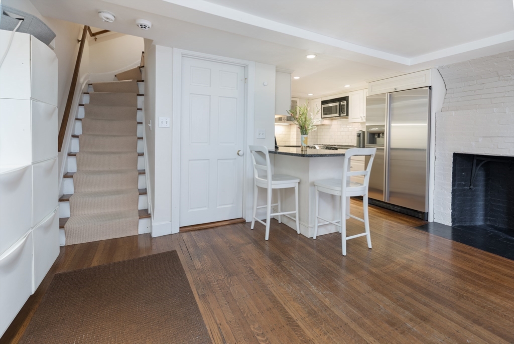 3 River St Place Boston, MA 02114 - Photo 5 of 28 a view of kitchen with furniture and wooden floor