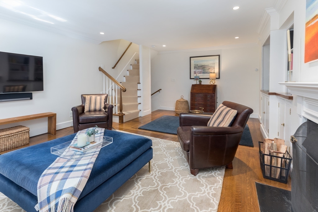 3 River St Place Boston, MA 02114 - Photo 9 of 28 a living room with furniture fireplace and flat screen tv