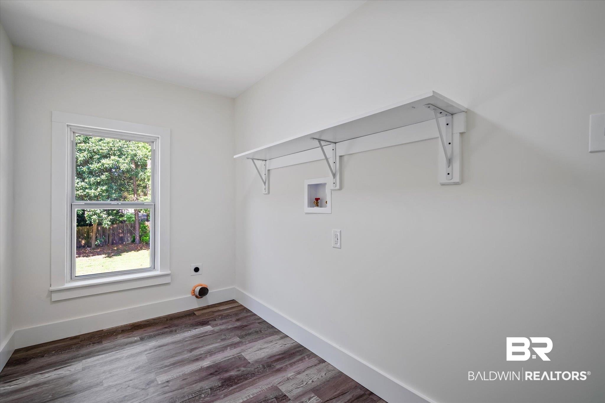 308 Byron Avenue West Mobile, AL 36609 - Photo 24 of 33 Laundry area featuring hookup for a washing machine, dark hardwood / wood-style floors, and hookup for an electric dryer
