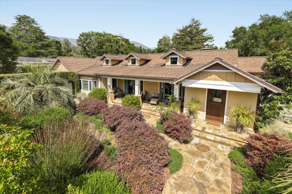 a front view of a house with garden