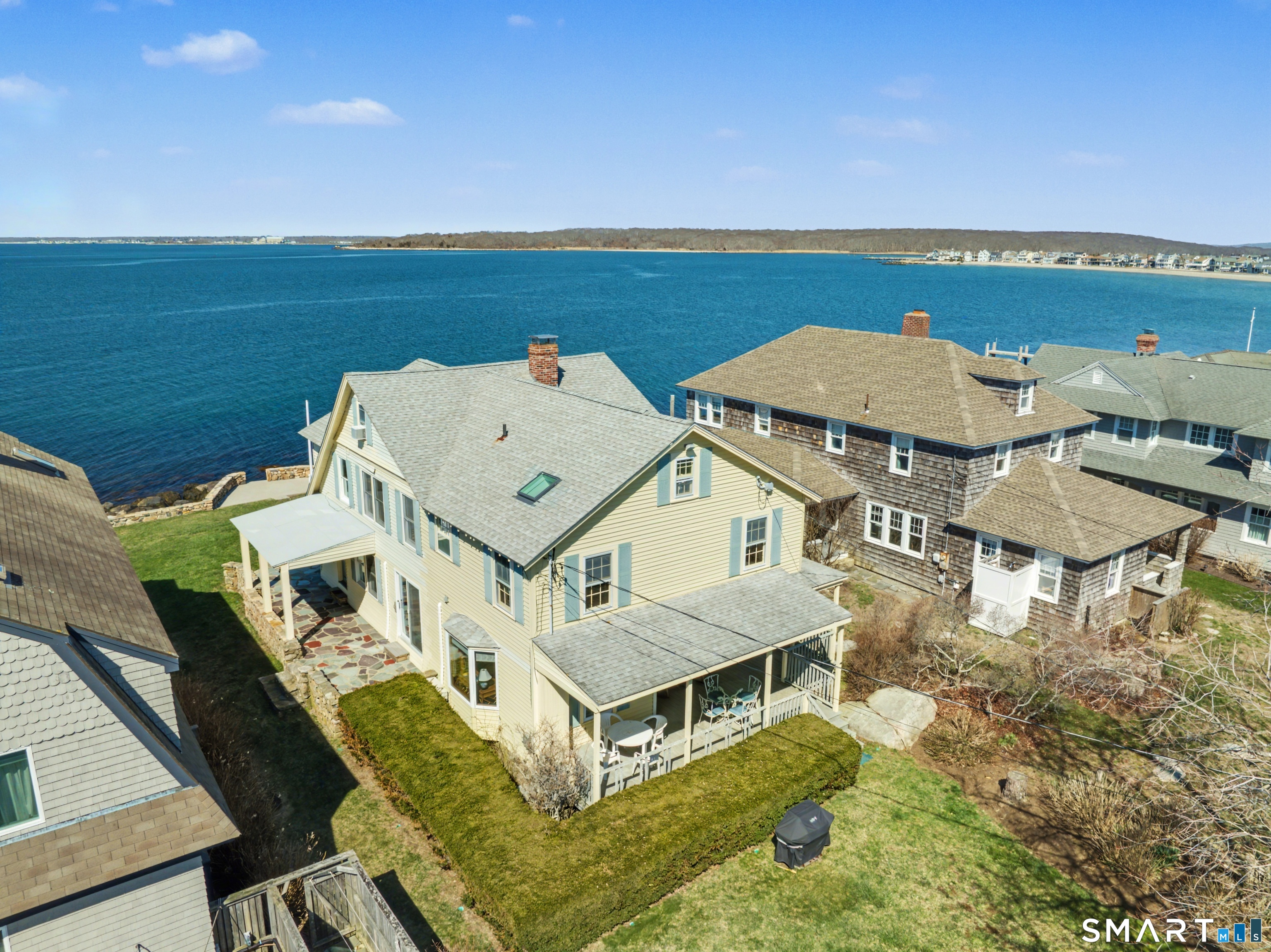 an aerial view of a house with a ocean view