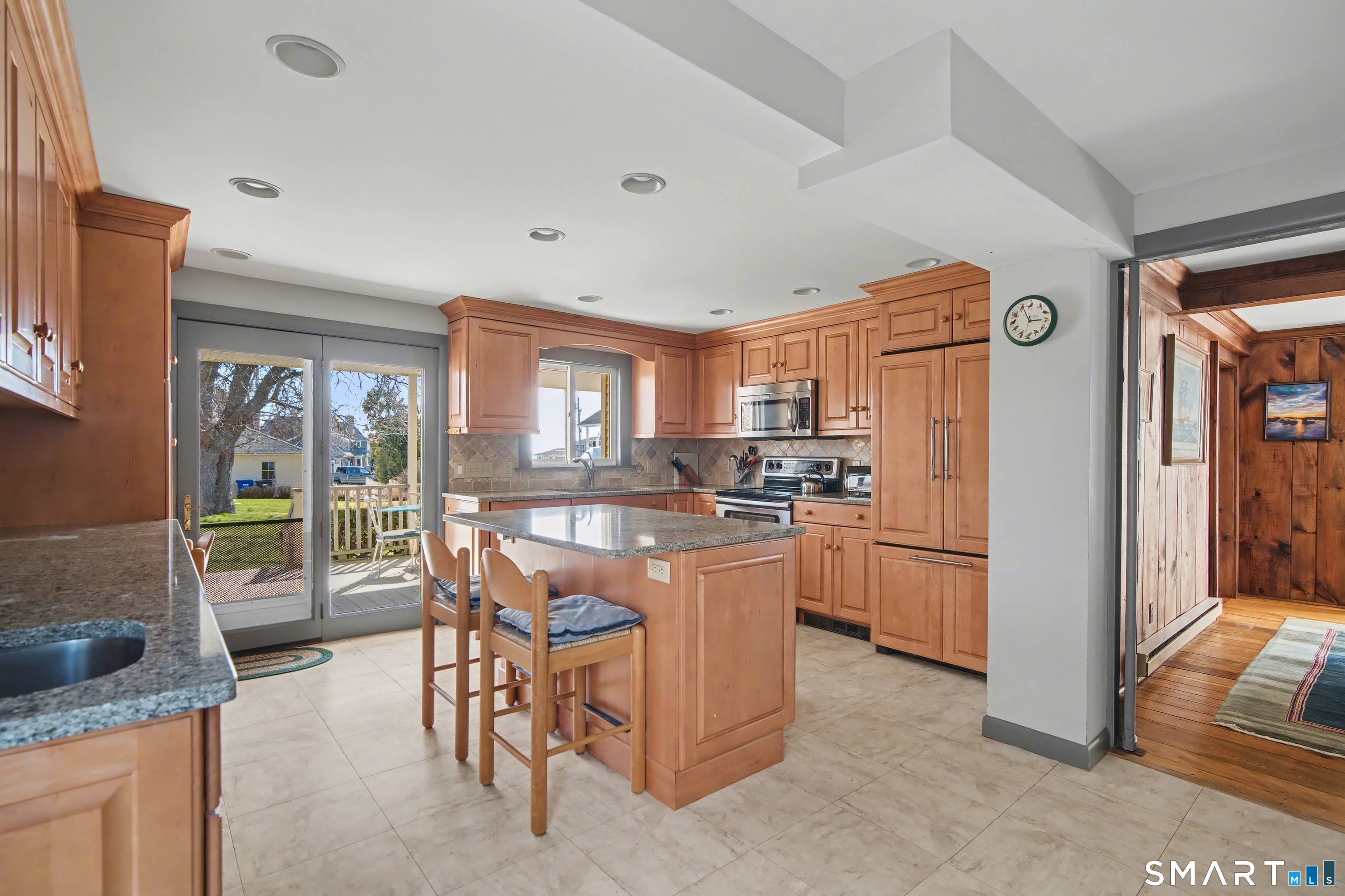 217 West Shore Avenue Groton, CT 06340 - Photo 11 of 34 a kitchen with stainless steel appliances granite countertop a refrigerator and a sink