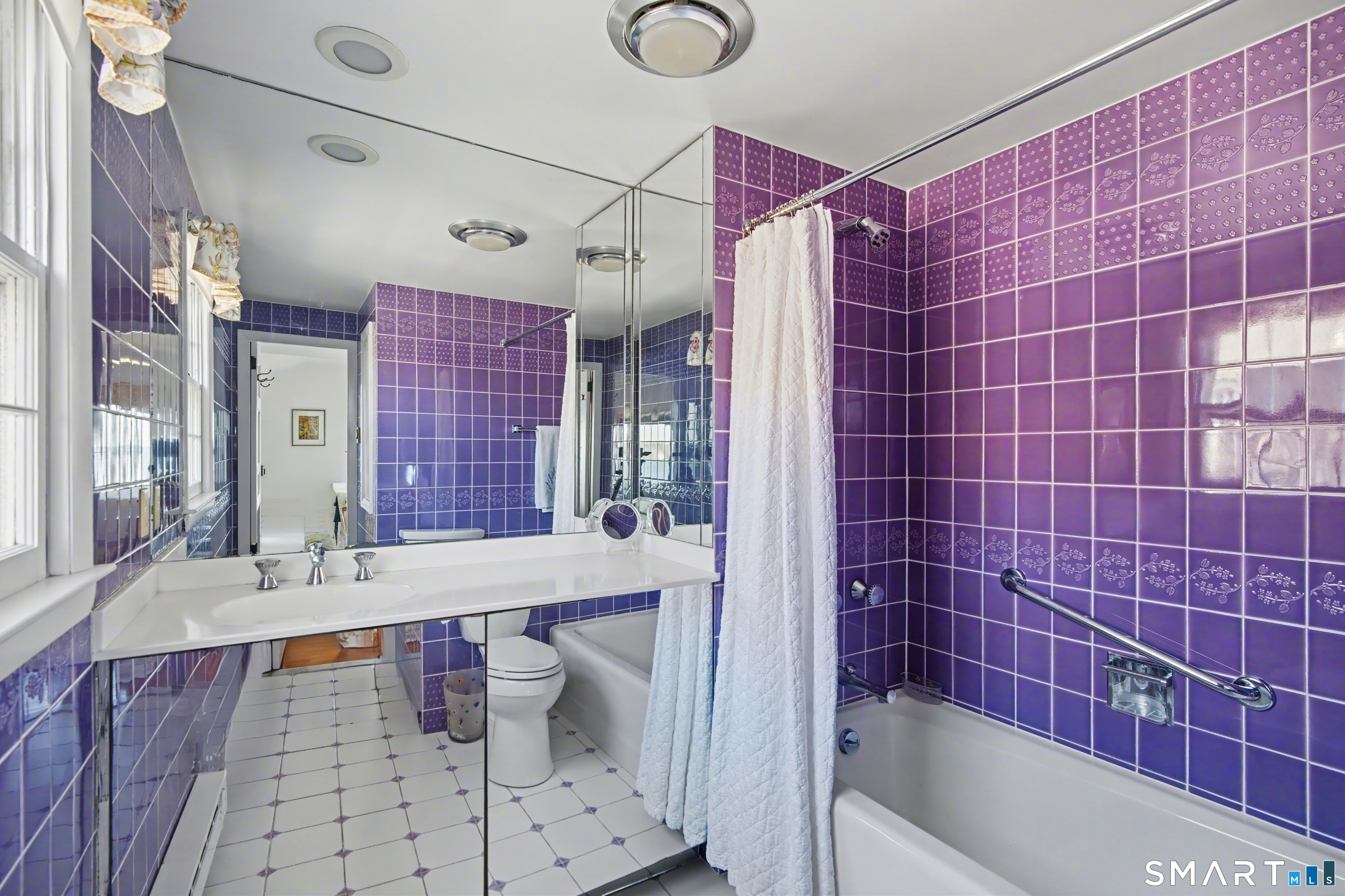 217 West Shore Avenue Groton, CT 06340 - Photo 14 of 34 a bathroom with a bathtub shower sink and toilet