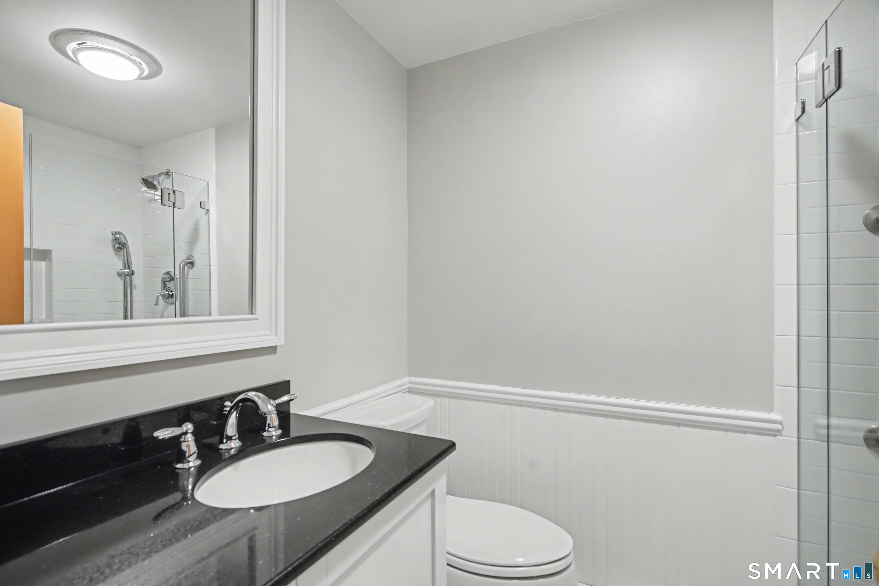 217 West Shore Avenue Groton, CT 06340 - Photo 20 of 34 a bathroom with a granite countertop sink toilet and shower