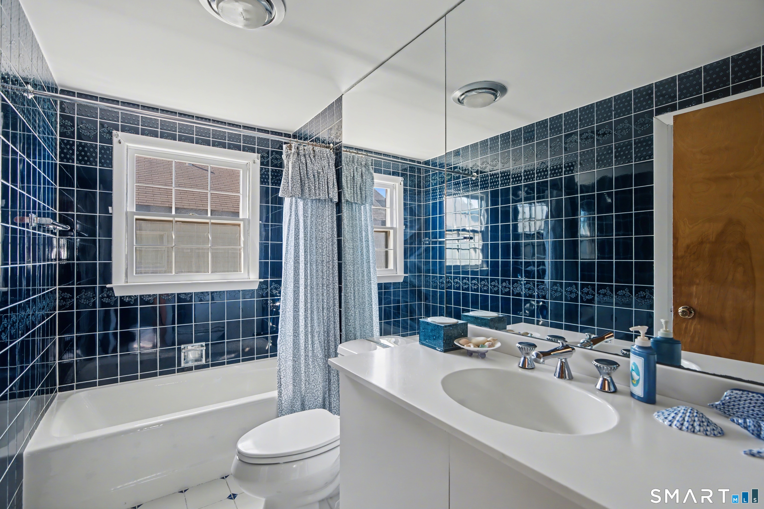 217 West Shore Avenue Groton, CT 06340 - Photo 22 of 34 a bathroom with a sink a toilet and shower