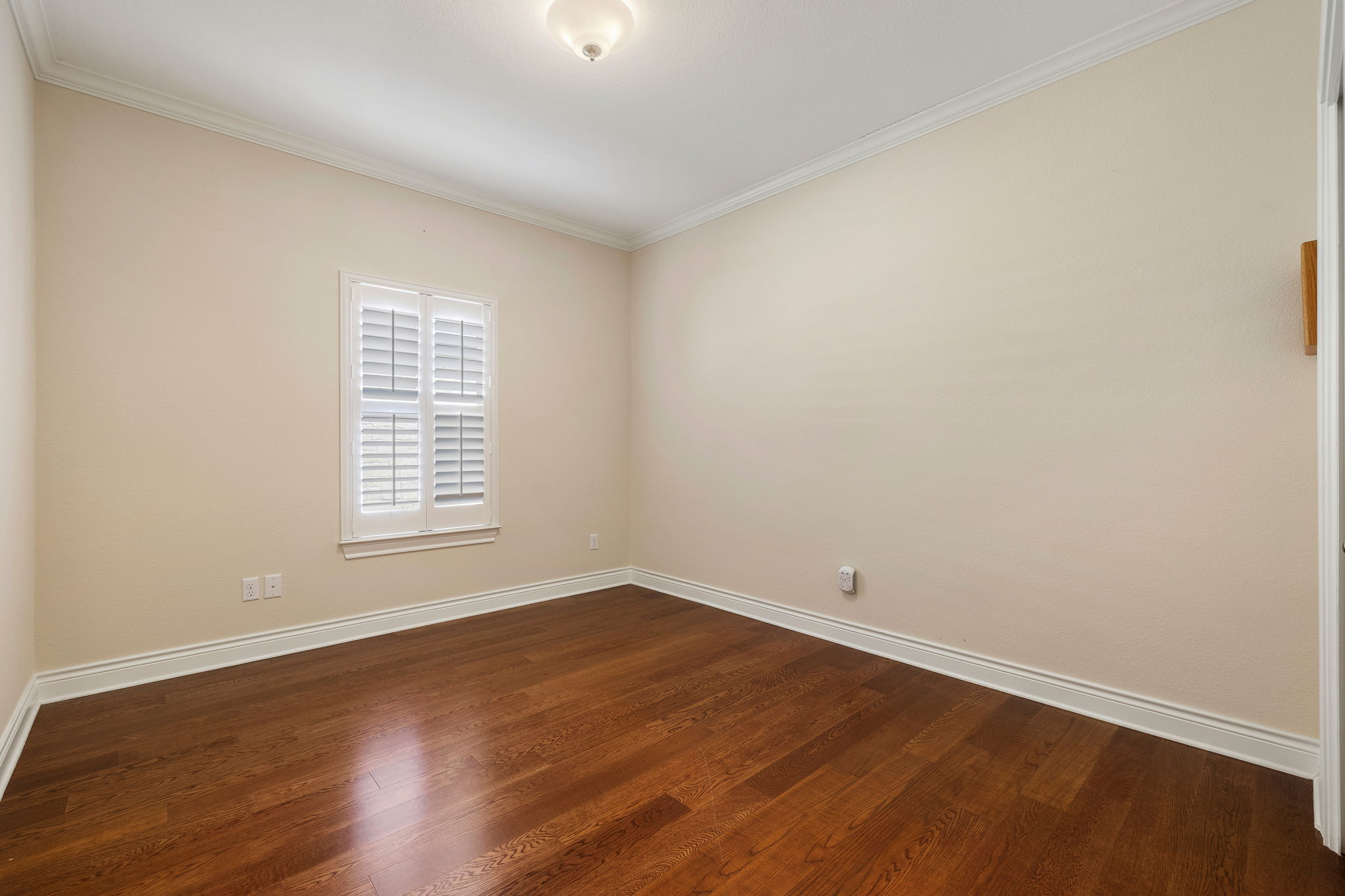 5201 Big Spring Street Georgetown, TX 78633 - Photo 17 of 26 Spare room with ornamental molding and dark wood-style floors