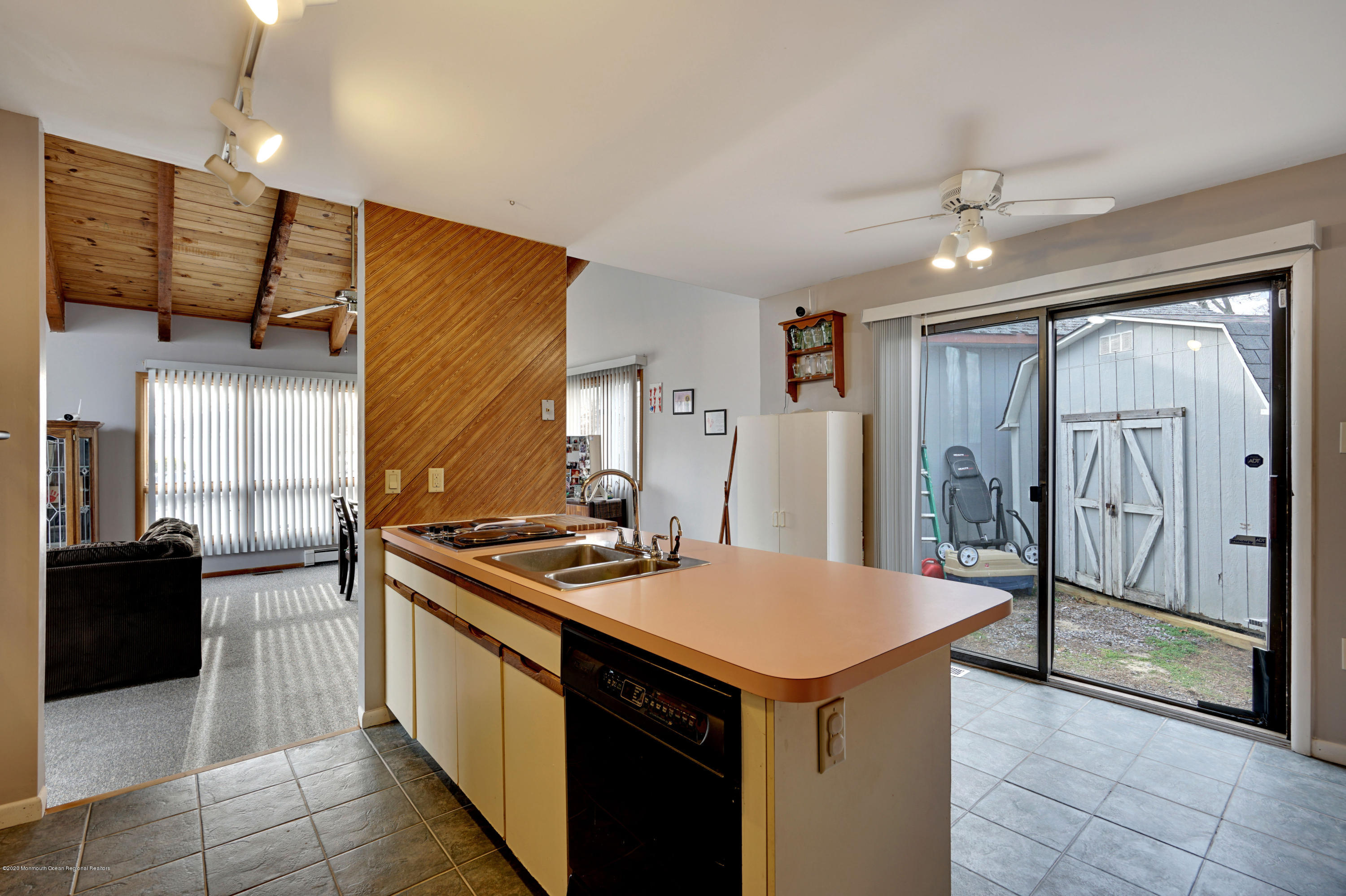 1761 Whitcomb Road Forked River, NJ 08731 - Photo 17 of 41 a kitchen with stainless steel appliances granite countertop a stove and a refrigerator