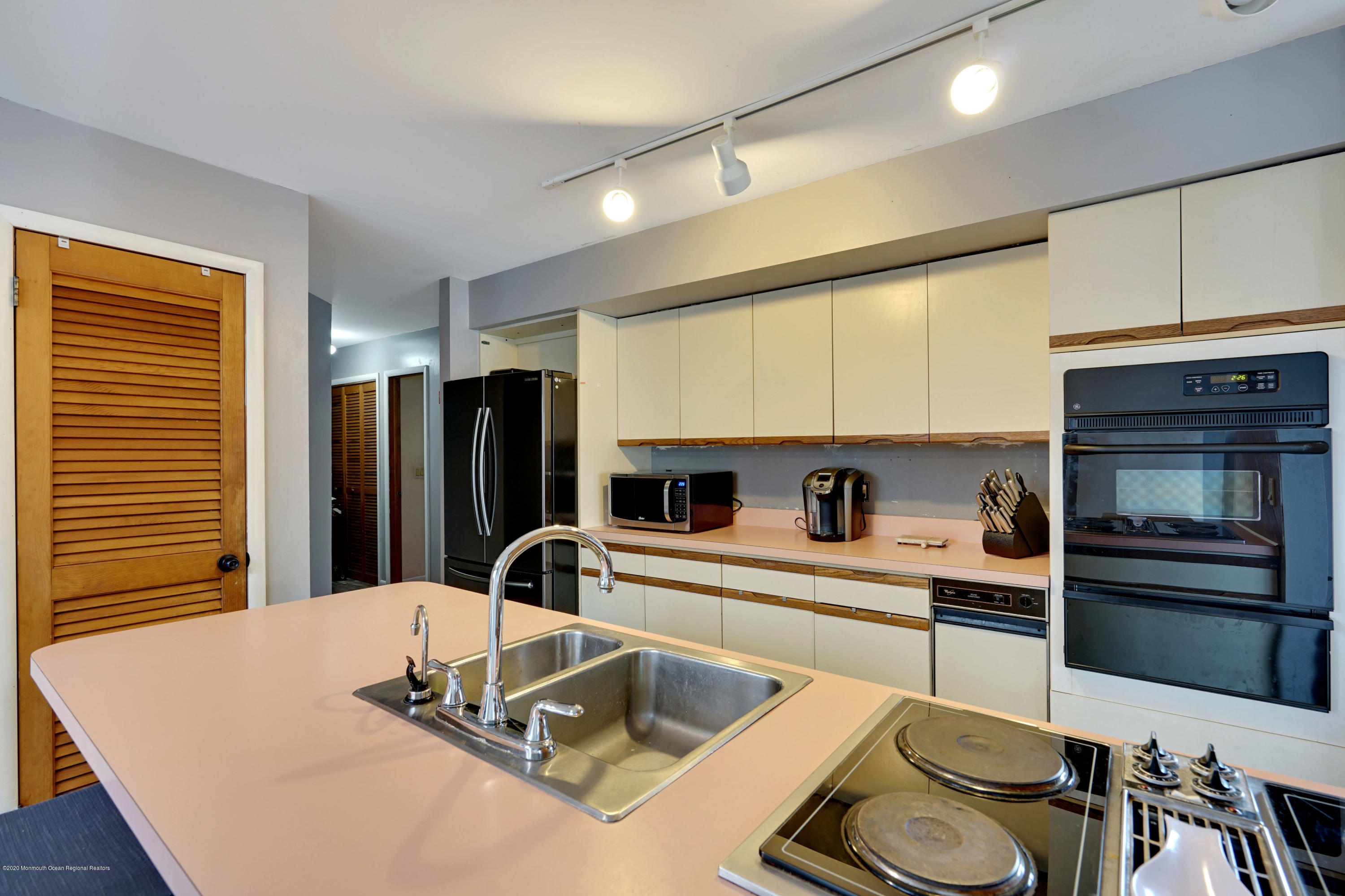 1761 Whitcomb Road Forked River, NJ 08731 - Photo 18 of 41 a kitchen with kitchen island a stove and a sink