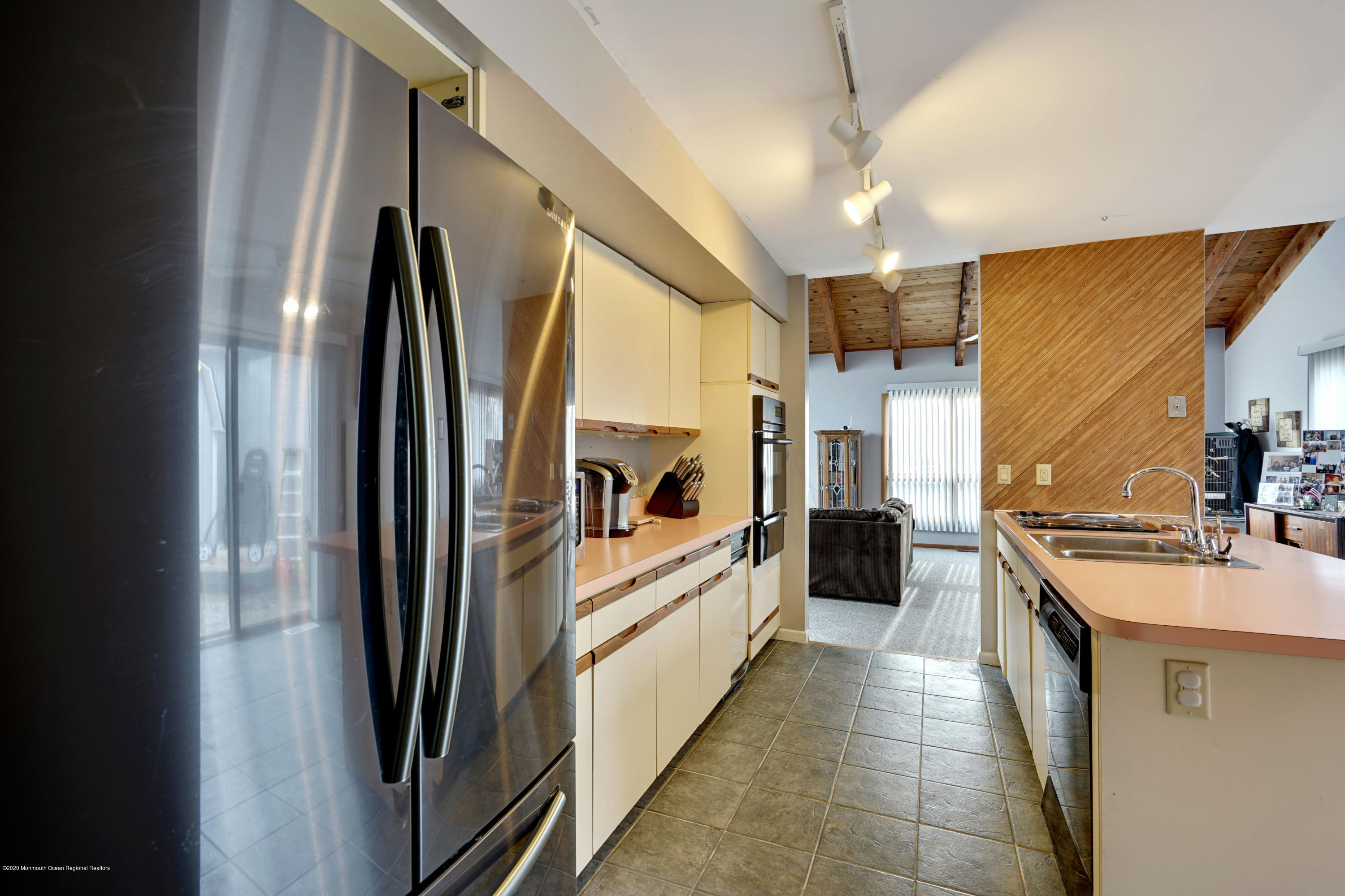 1761 Whitcomb Road Forked River, NJ 08731 - Photo 19 of 41 a kitchen with stainless steel appliances a refrigerator and a sink