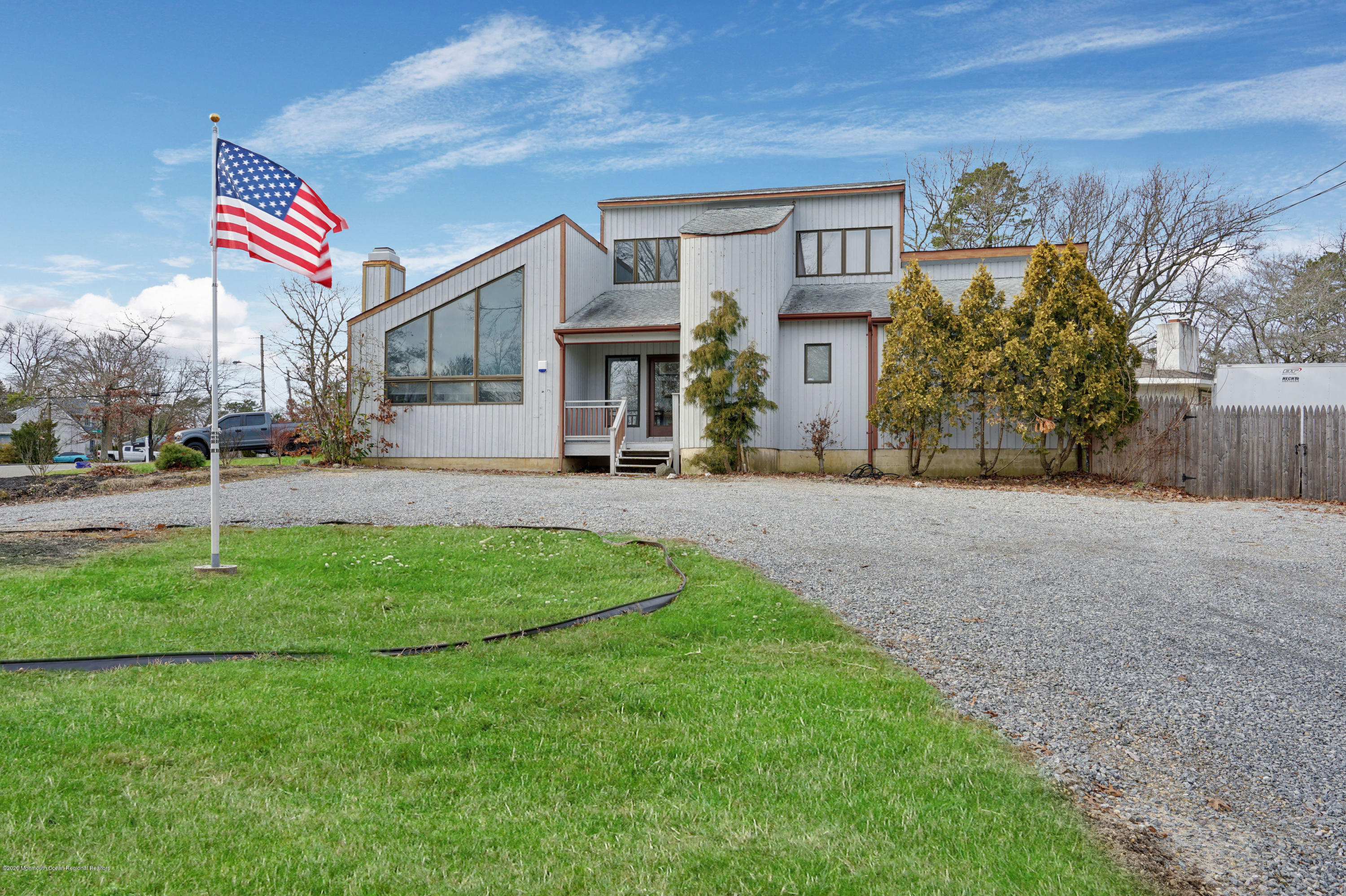 1761 Whitcomb Road Forked River, NJ 08731 - Photo 3 of 41 a front view of a house with garden