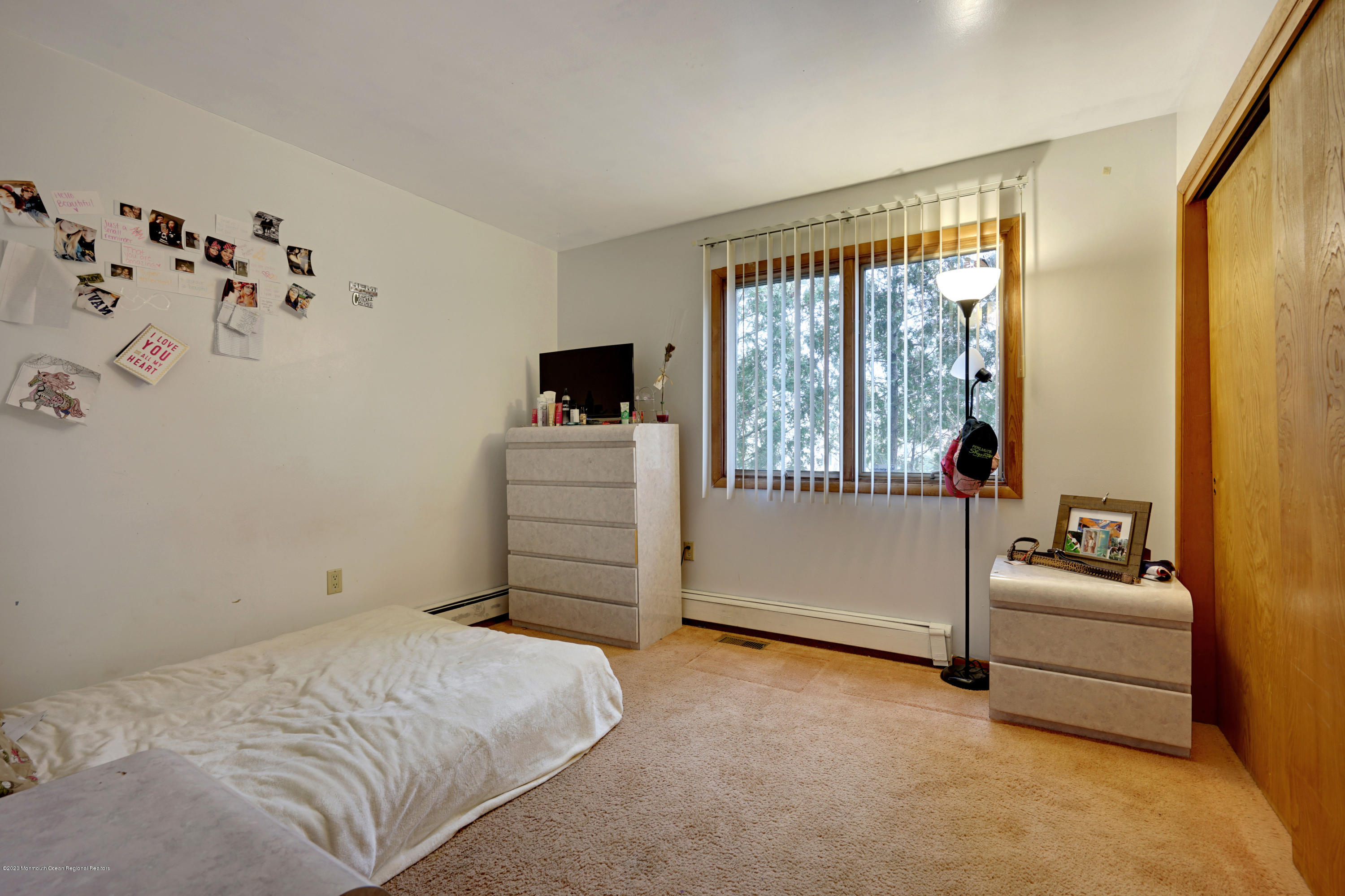 1761 Whitcomb Road Forked River, NJ 08731 - Photo 25 of 41 a bedroom with a bed and a couch
