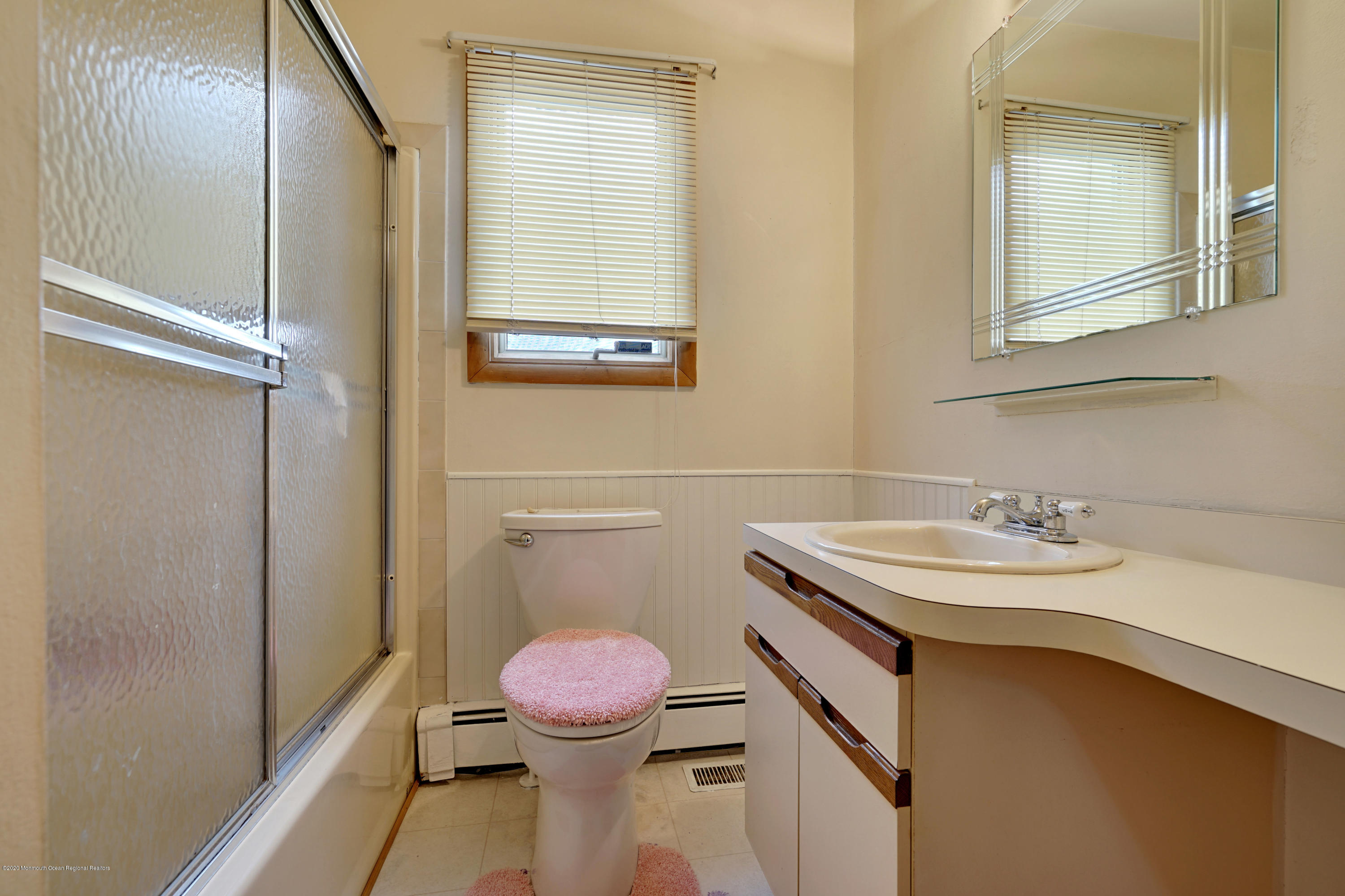 1761 Whitcomb Road Forked River, NJ 08731 - Photo 26 of 41 a bathroom with a sink a toilet and a mirror