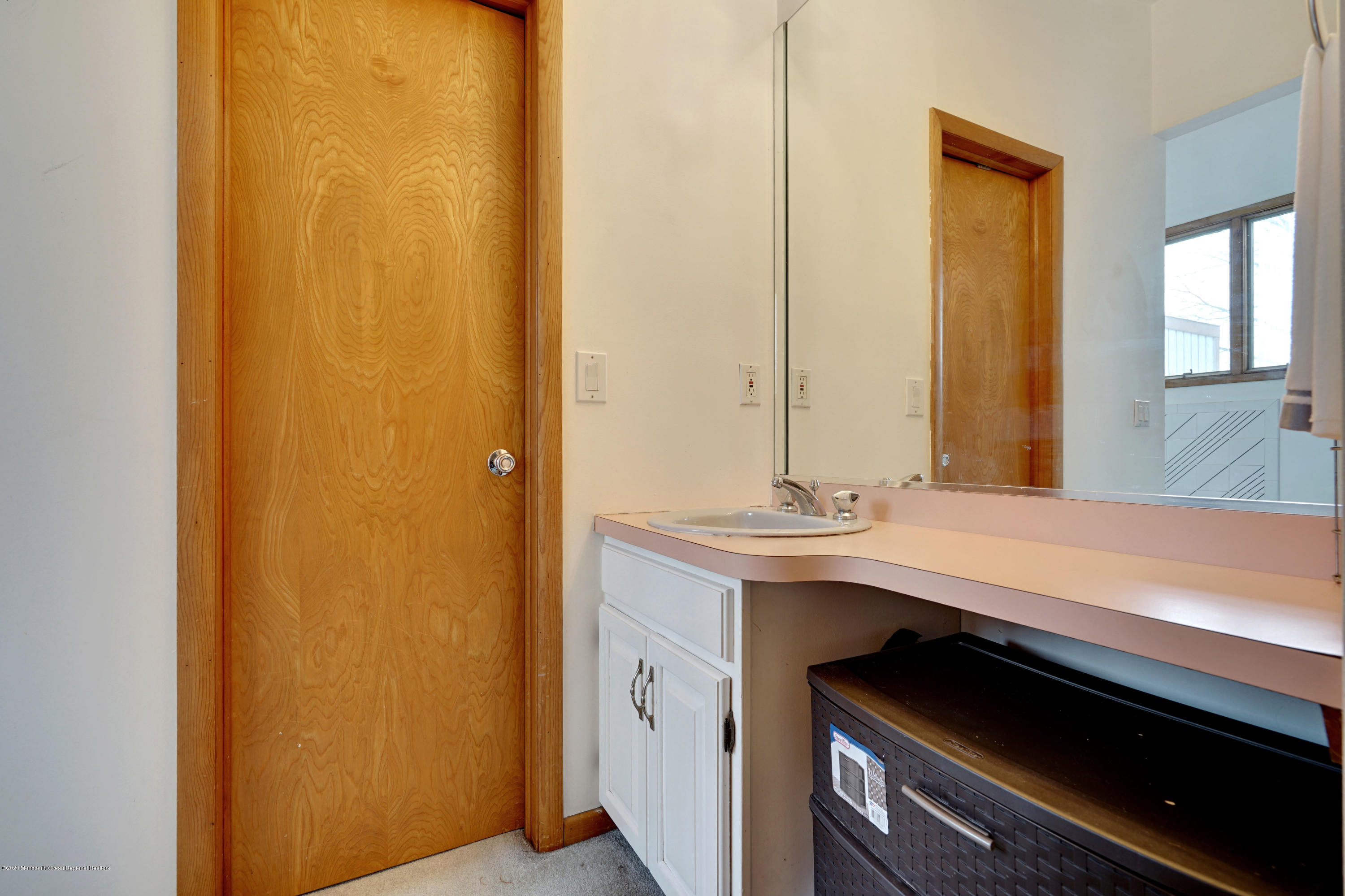 1761 Whitcomb Road Forked River, NJ 08731 - Photo 31 of 41 a bathroom with a sink and a mirror
