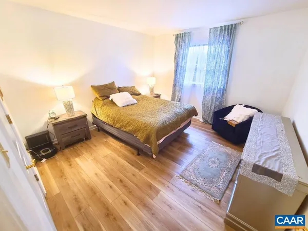 a living room with a bed and a couch