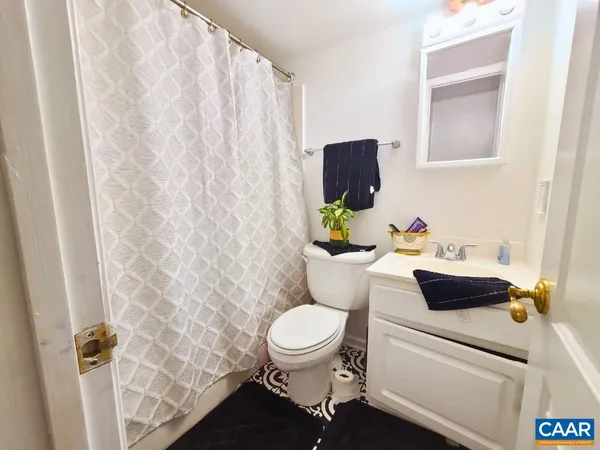 a bathroom with a toilet and a sink