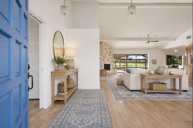 an empty room with sliding glass door and view of the outdoor space