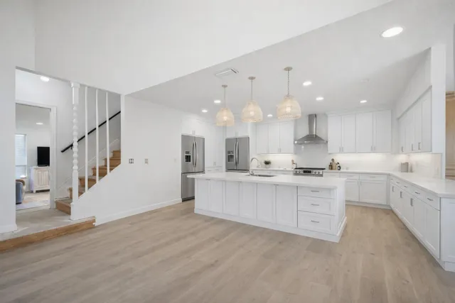 a spacious bedroom with a bed and a window