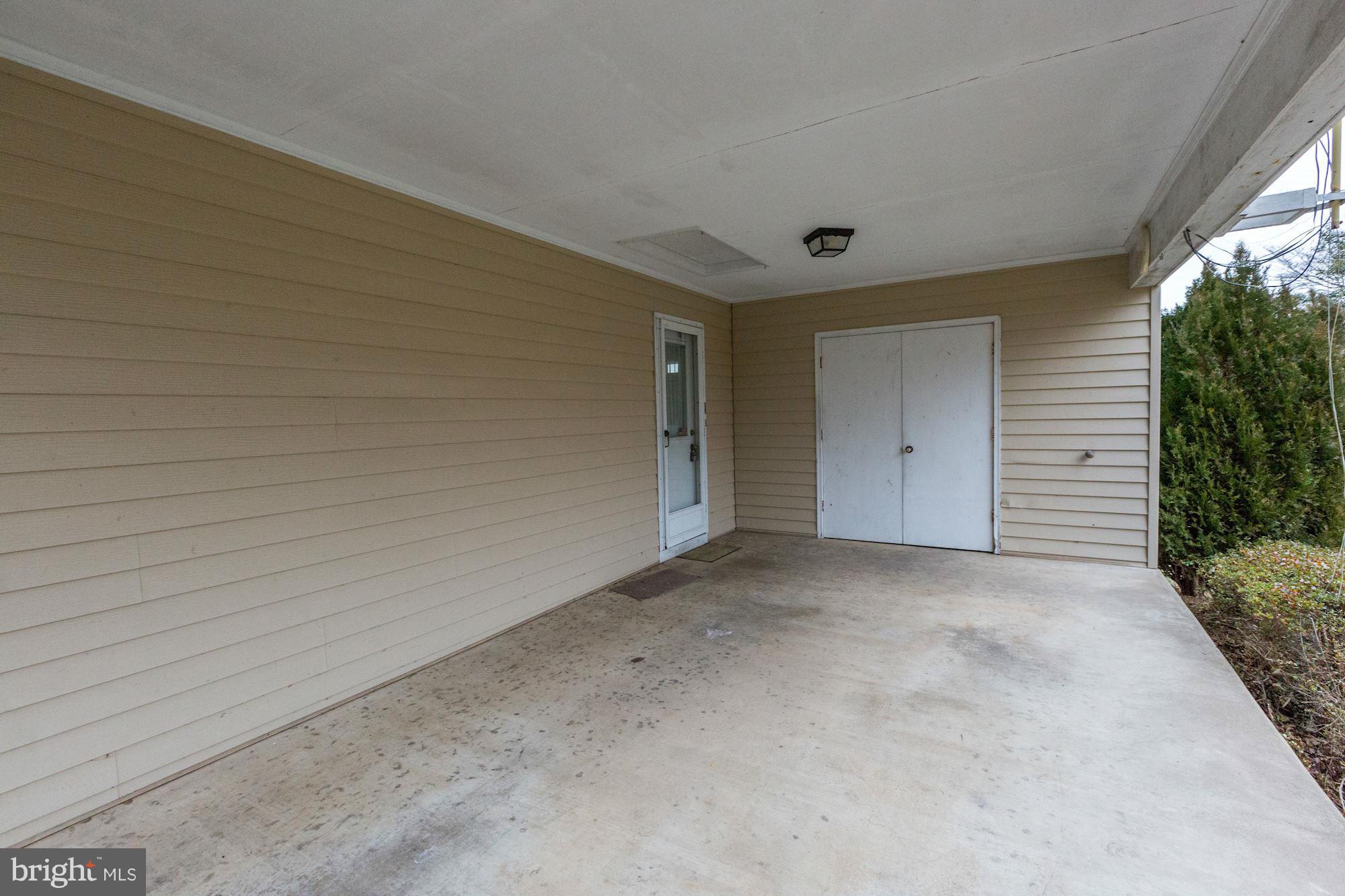 16015 West Old Baltimore Road Boyds, MD 20841 - Photo 18 of 24 Carport with side entrance and storage