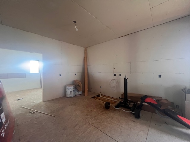 100 South 4th Street Wapella, IL 61777 - Photo 11 of 16 a room with gym equipment and a view of living room