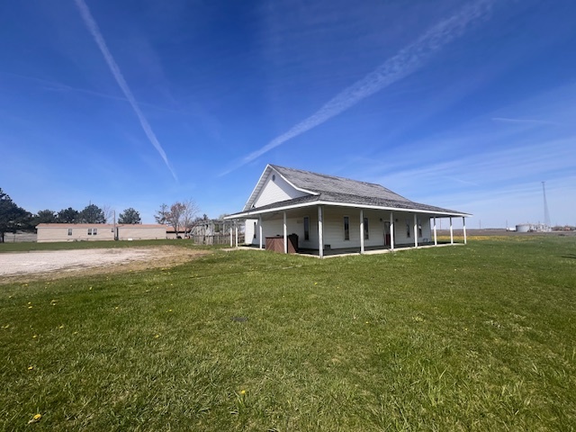 100 South 4th Street Wapella, IL 61777 - Photo 15 of 16 a view of a house with a yard and sitting area