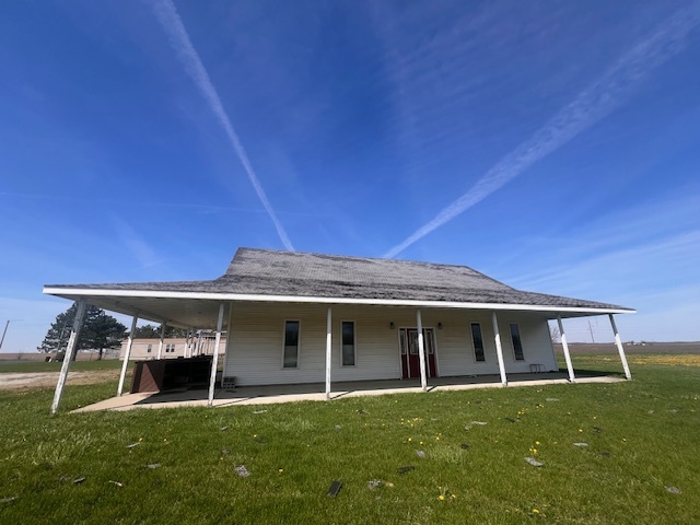 100 South 4th Street Wapella, IL 61777 - Photo 16 of 16 a front view of a house with a yard