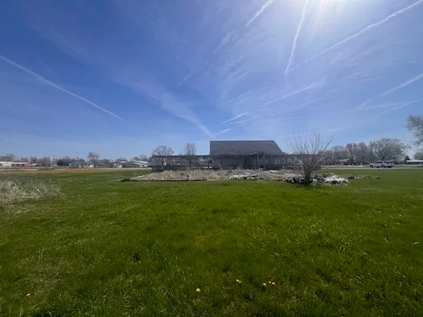 a view of a house with a big yard