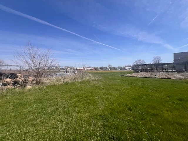 a room with gym equipment and a view of living room