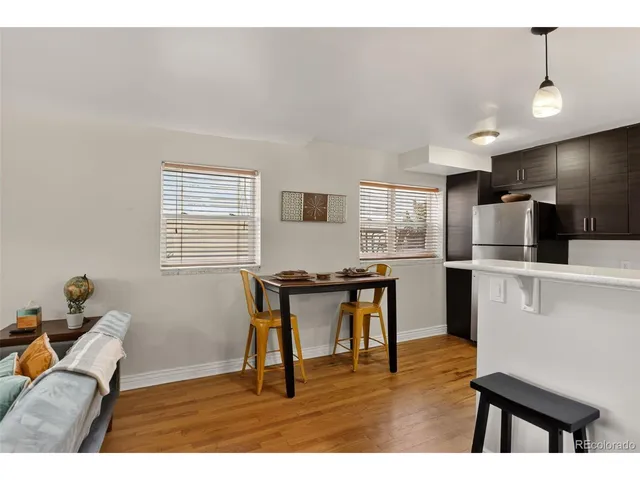 a workspace with furniture window and wooden floor