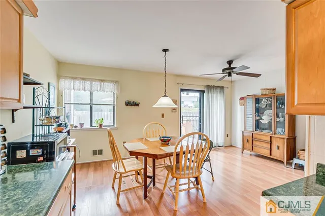 a view of a dining room with furniture and window