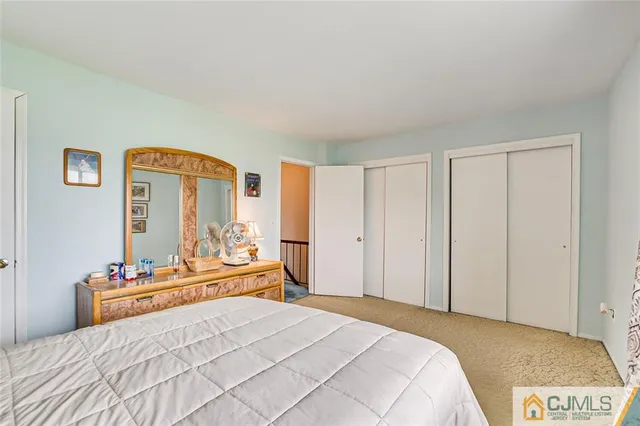 a bedroom with a bed and a cabinets