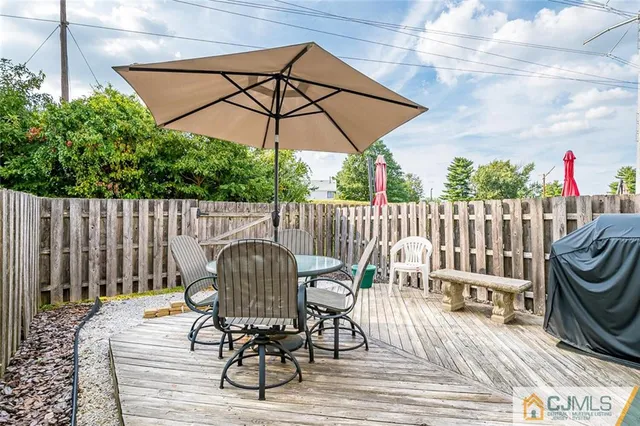 a view of a chairs and table in the patio