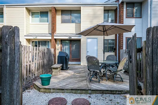 a front view of house with outdoor seating