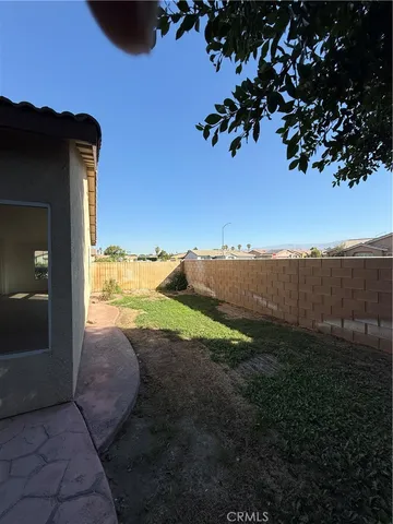 a view of a backyard of the house