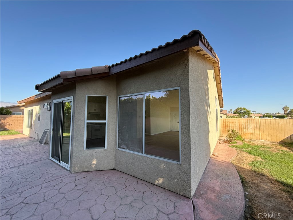 47686 Mirage Way Indio, CA 92201 - Photo 8 of 23 a view of a house with backyard