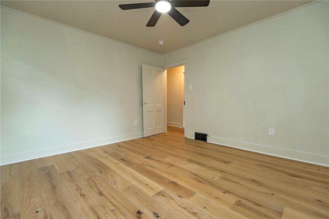 100 Creek Road Bangor, PA 18013 - Photo 48 of 51 A well-lit bedroom features durable hardwood flooring and a functional ceiling fan for optimal comfort.