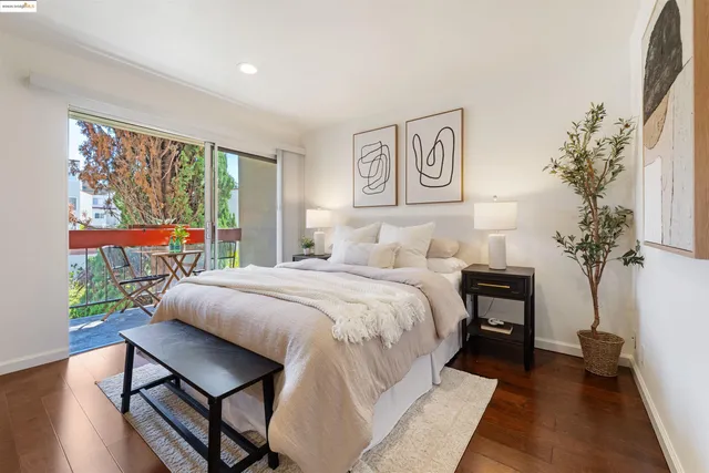 a bathroom with a granite countertop sink a mirror and shower