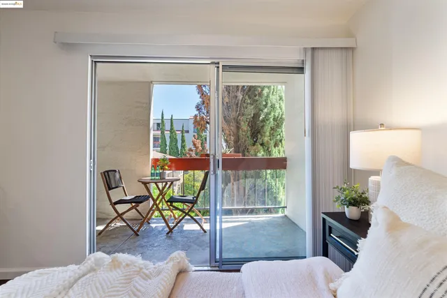 a view of balcony with wooden floor