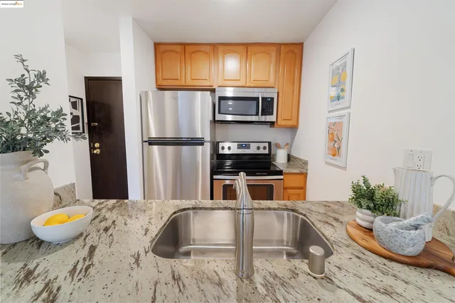 a bed room with a bed a mirror and a potted plant