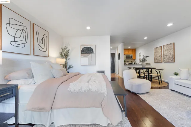 a bedroom with a bed and a potted plant