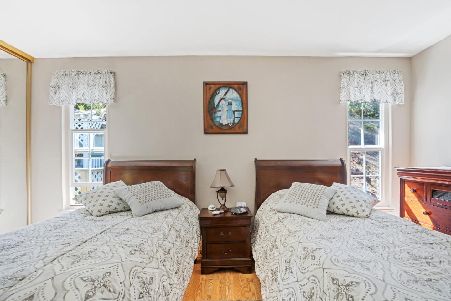 1128 Oddstad Boulevard Pacifica, CA 94044 - Photo 11 of 35 a bedroom with two beds and a large window