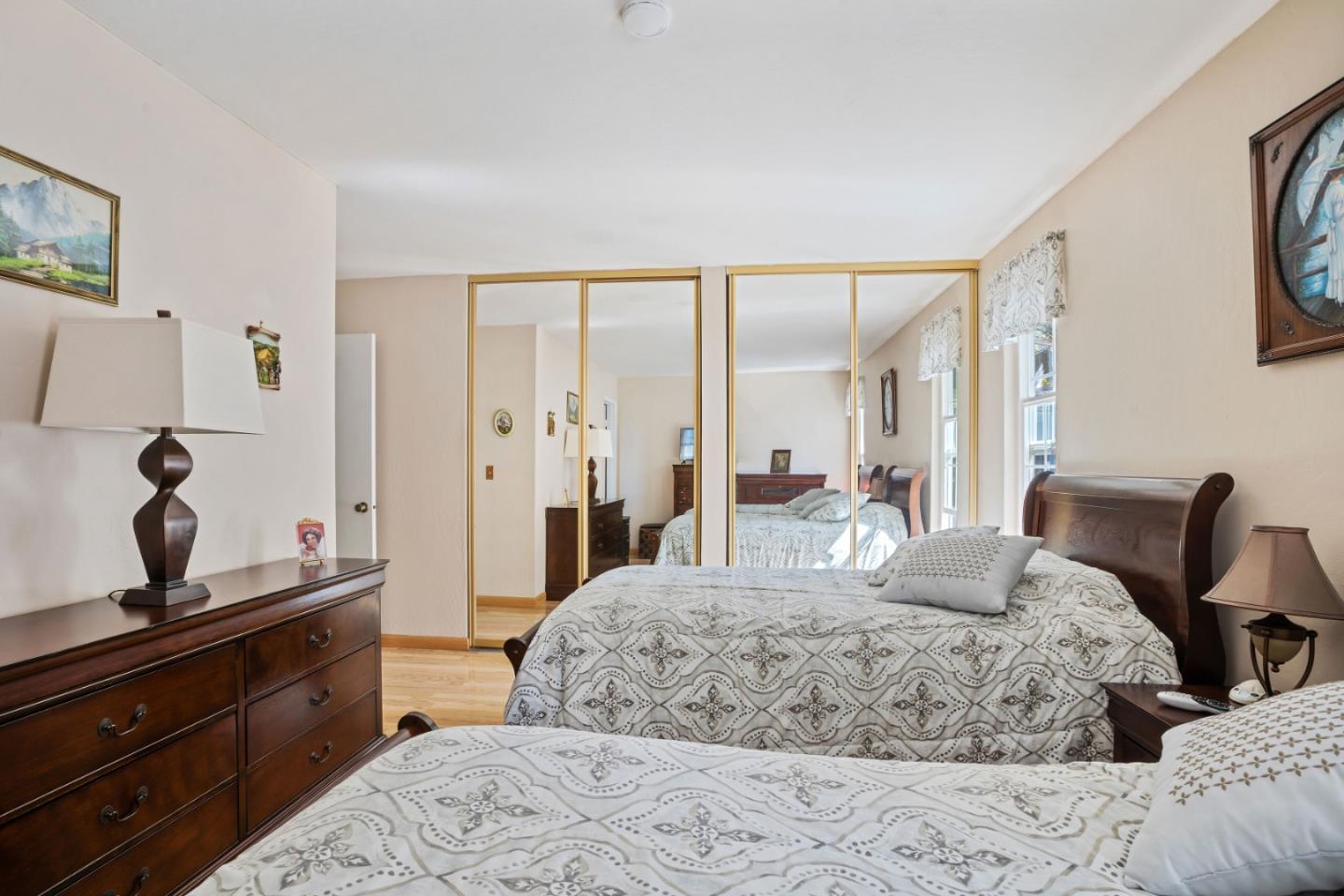 1128 Oddstad Boulevard Pacifica, CA 94044 - Photo 12 of 35 a bedroom with a large bed and a lamp