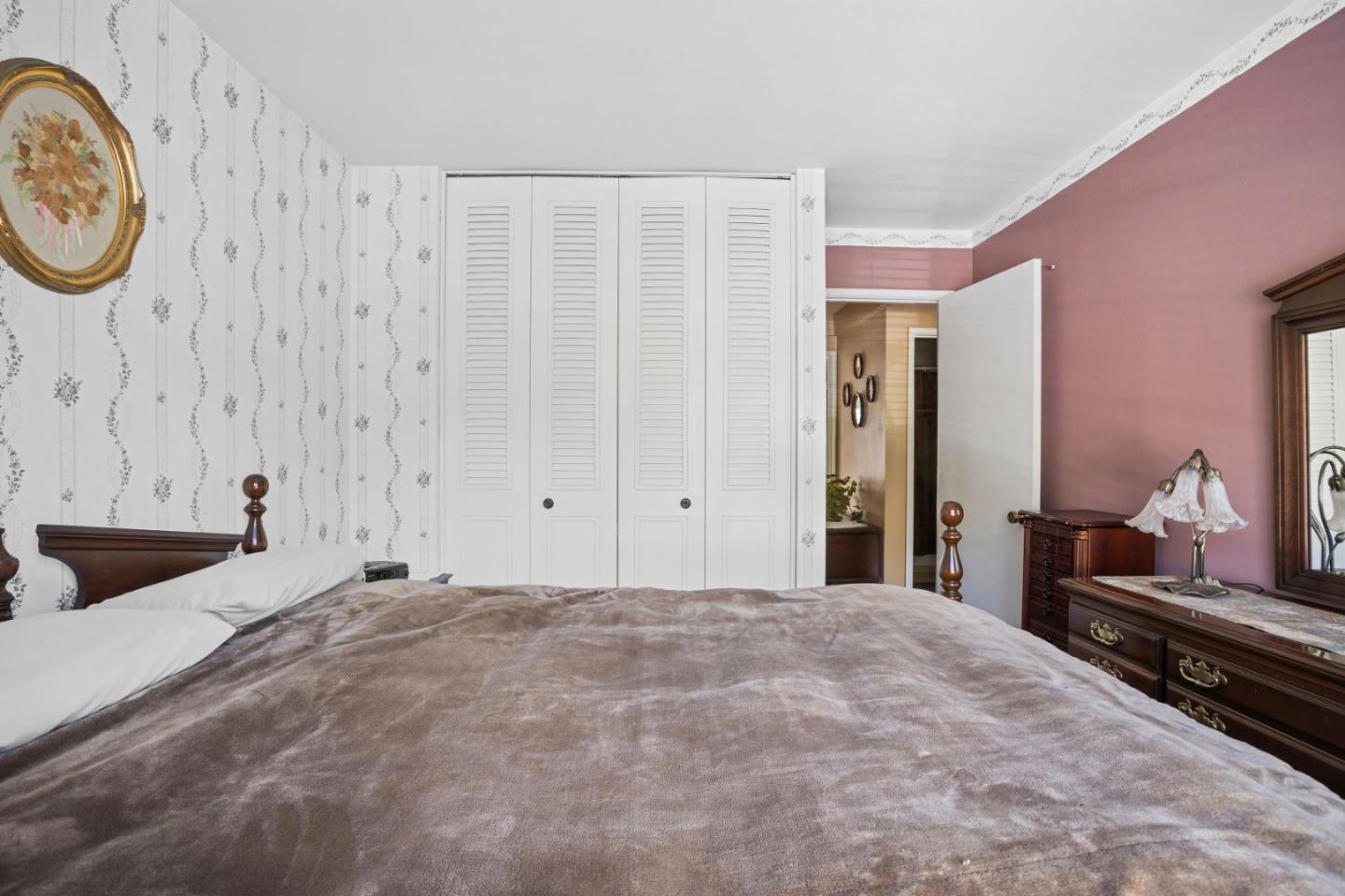 1128 Oddstad Boulevard Pacifica, CA 94044 - Photo 16 of 35 a bedroom with a bed and a closet