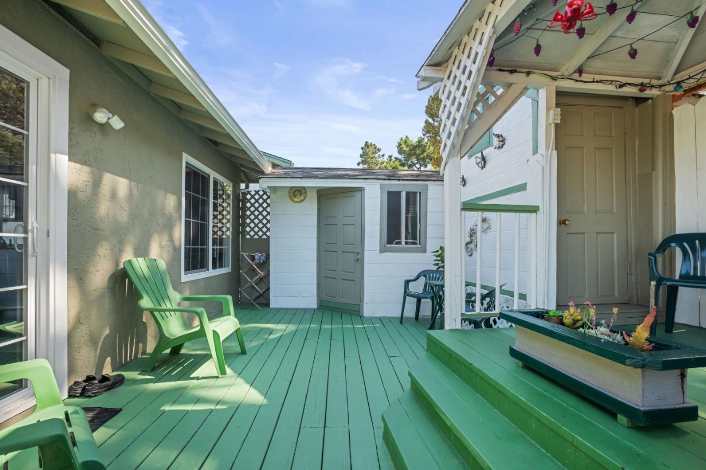 1128 Oddstad Boulevard Pacifica, CA 94044 - Photo 23 of 35 a view of house with yard floor to ceiling window and potted plants