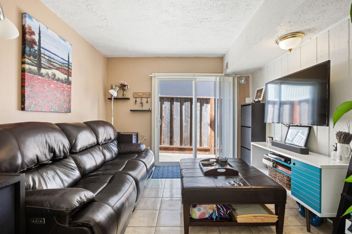 1128 Oddstad Boulevard Pacifica, CA 94044 - Photo 26 of 35 a living room with furniture and a window
