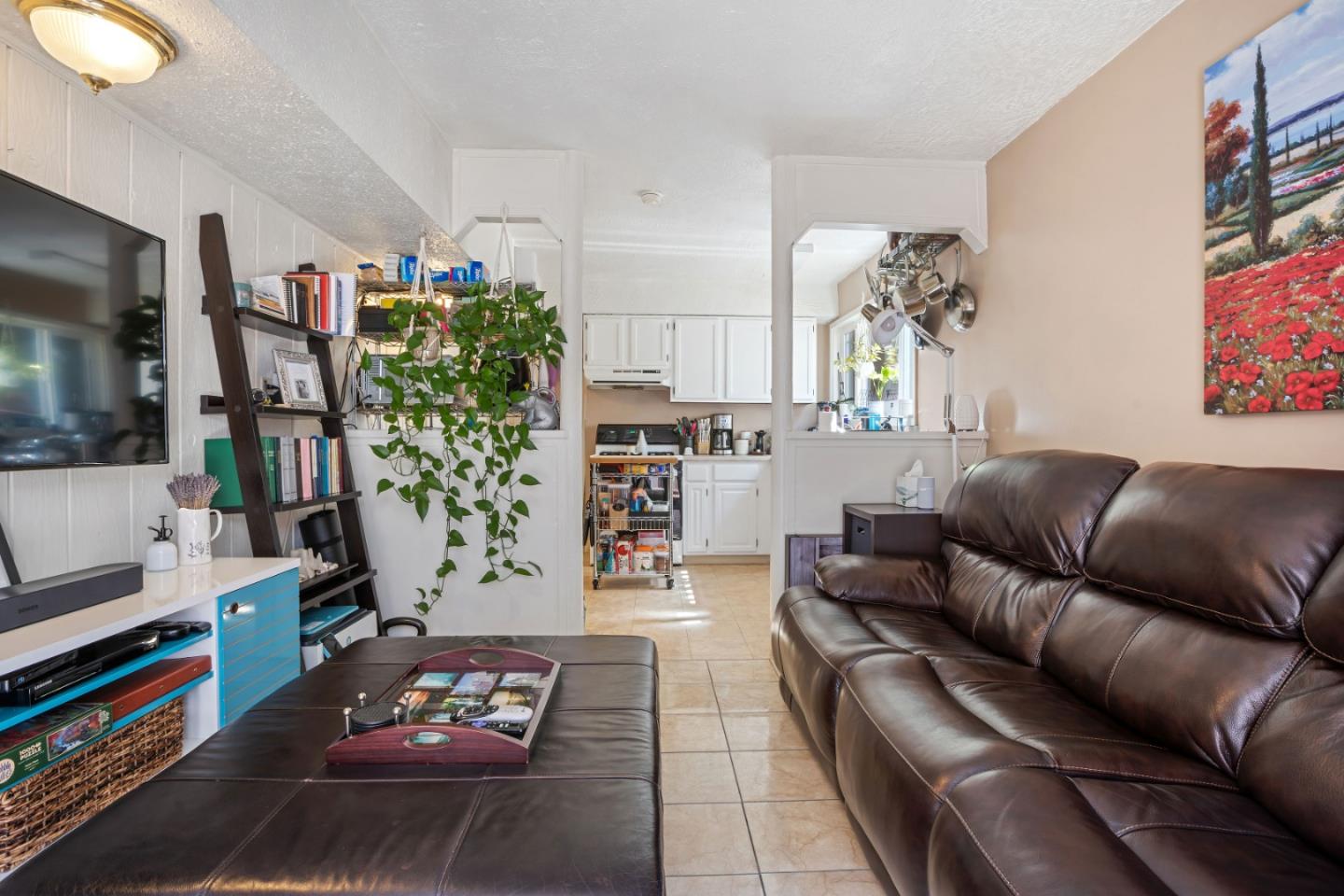 1128 Oddstad Boulevard Pacifica, CA 94044 - Photo 27 of 35 a living room with furniture and a flat screen tv