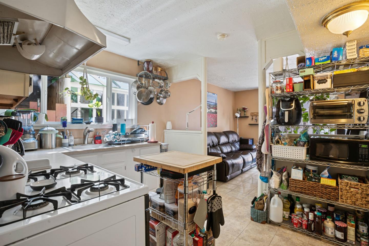 1128 Oddstad Boulevard Pacifica, CA 94044 - Photo 29 of 35 a room with lots of furniture and white equipment