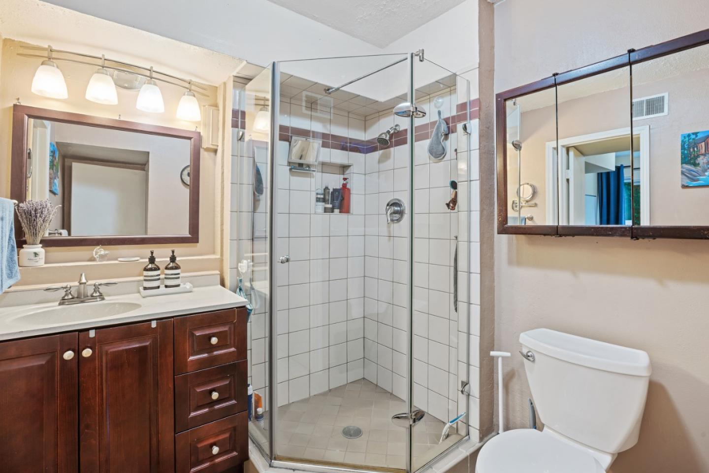 1128 Oddstad Boulevard Pacifica, CA 94044 - Photo 30 of 35 a bathroom with a sink a toilet and shower